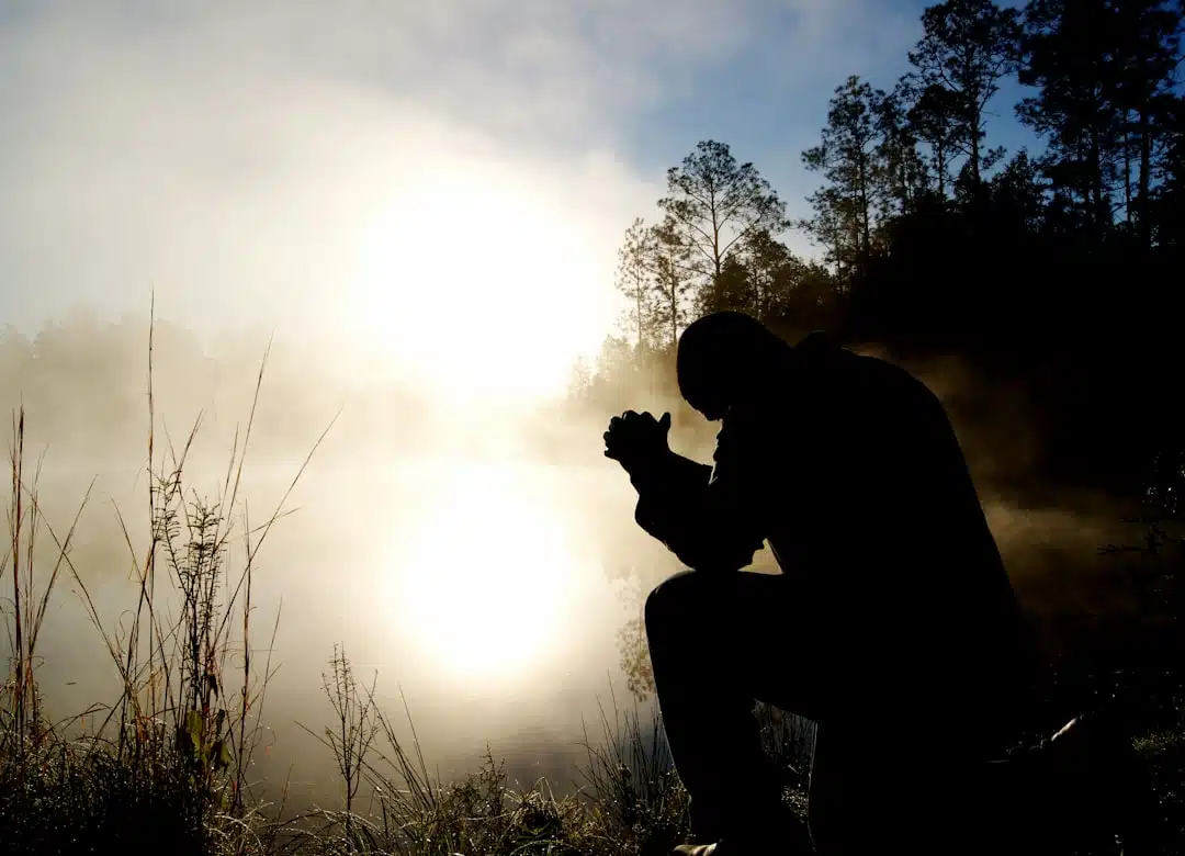 Person in peaceful prayer or reflection, representing the integration of faith and mental health